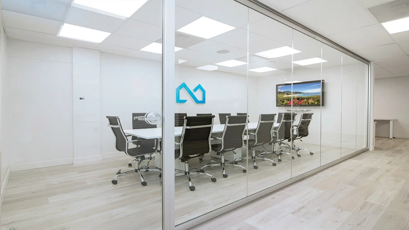 Fire-rated glass wall in a commercial corridor